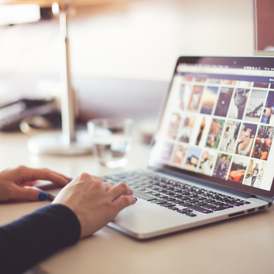 Person using social media on a laptop